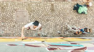 Top,View,Of,Graffiti,Artist,Painting,With,Color,Spray,On  第1张
